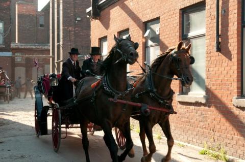 Team and carriage with Lead actor  on the run