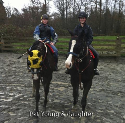 Pat Young on race horse, along side his daughter